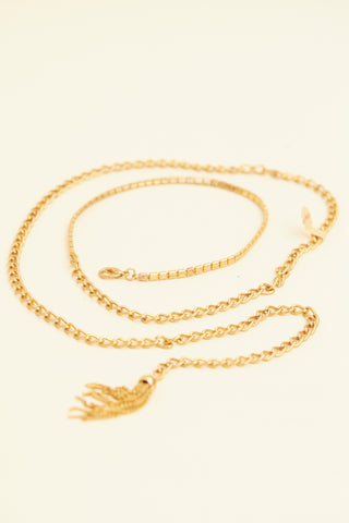 Long gold chain with tassle